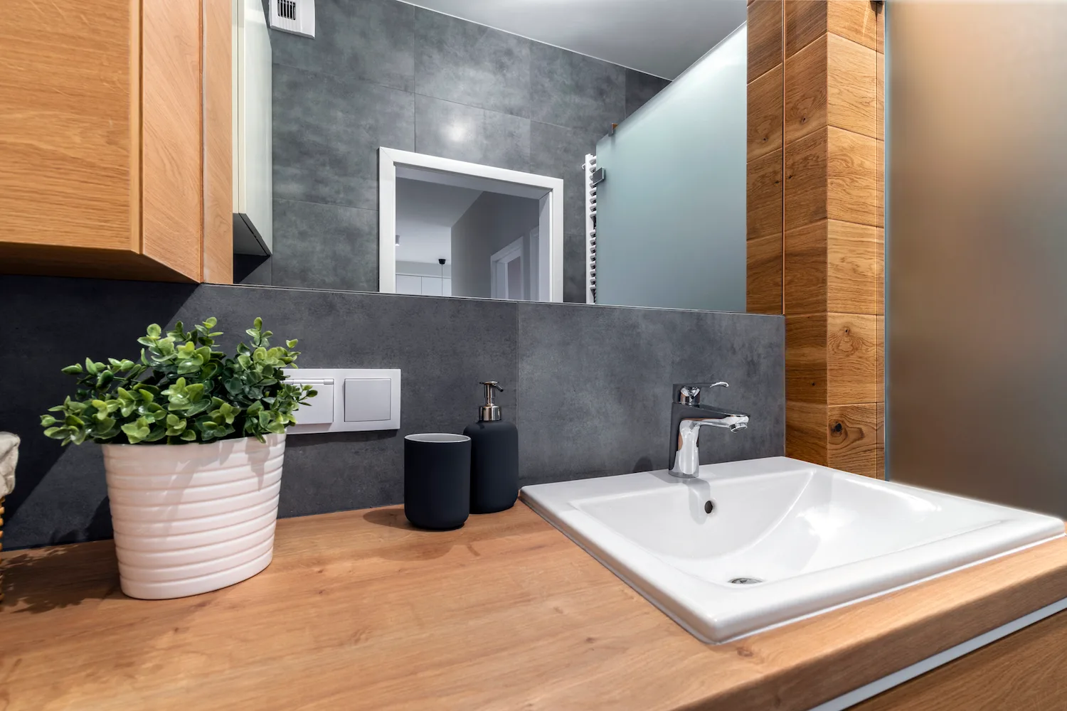 Close-up of a renovated vanity with stone benchtop and tapware
